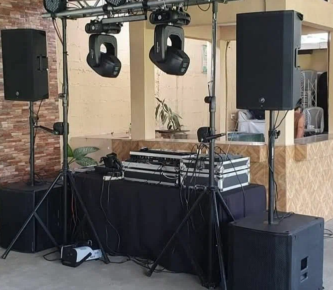 Technicians operating sound and lighting desks during an event