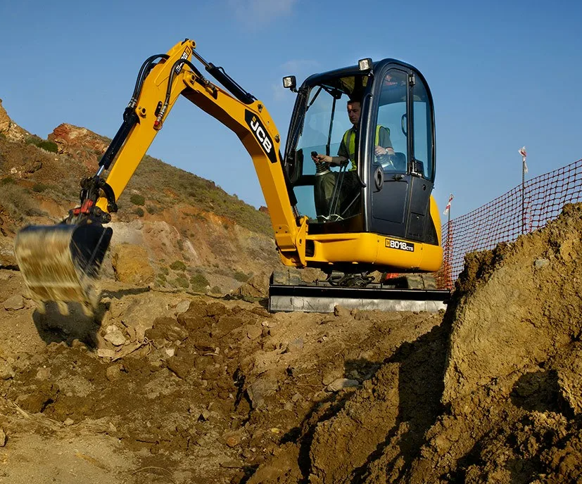 Mini excavator working on a compact urban site
